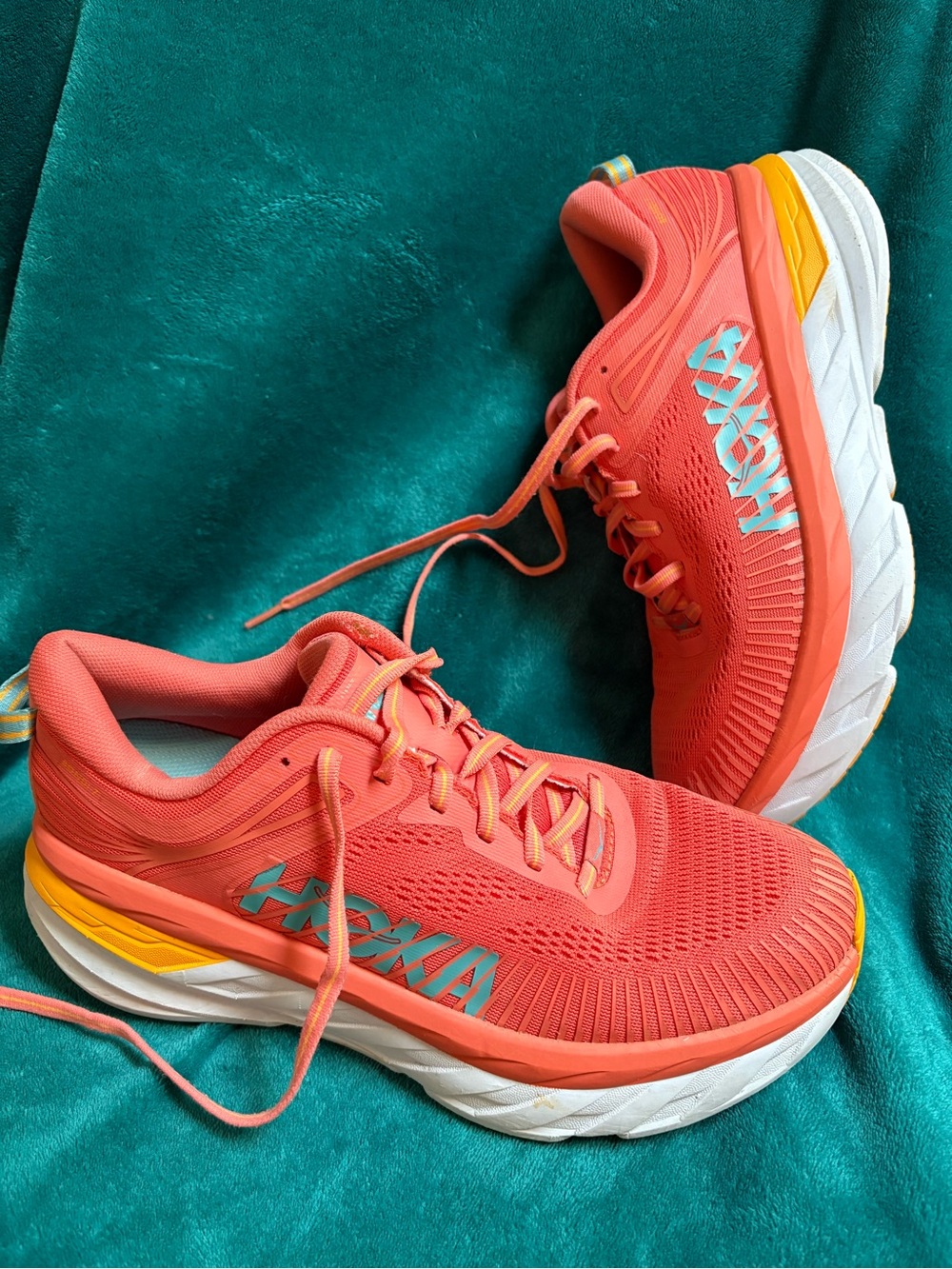 Hoka One One Coral Running Shoes with Teal Logo and Yellow Accents